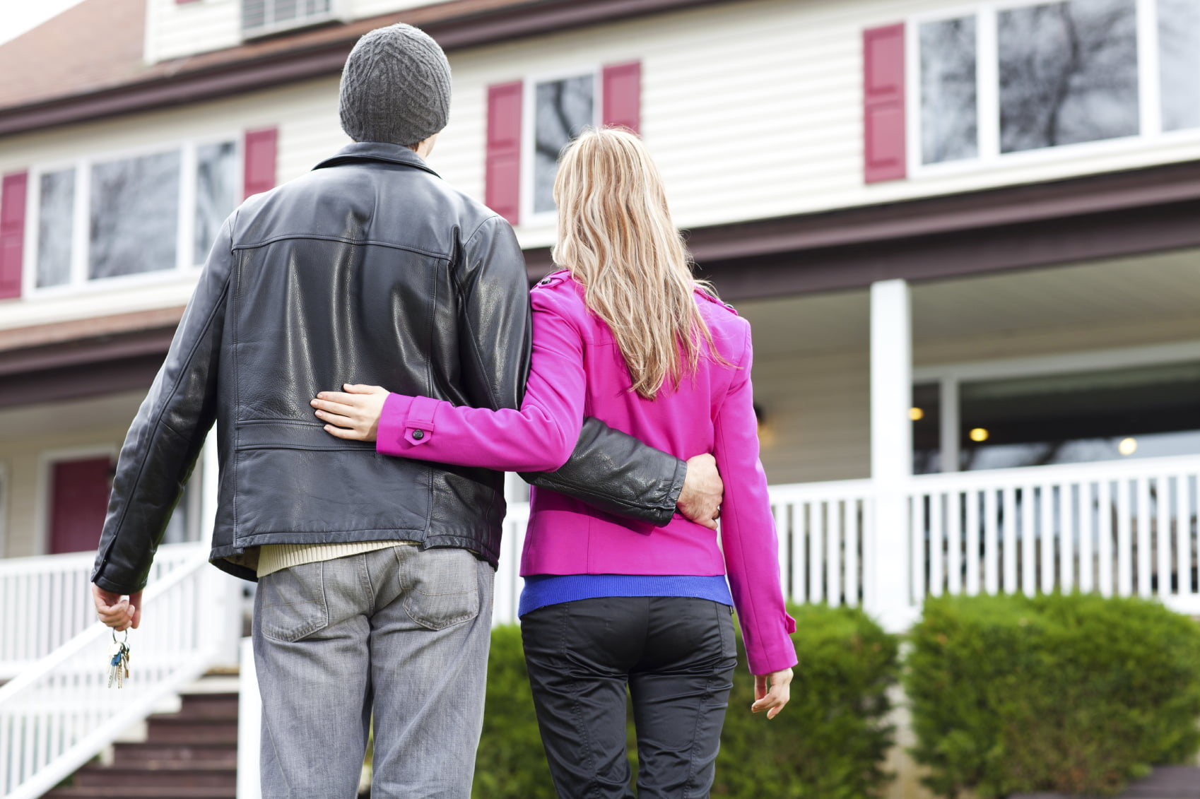 Young couple looking at their new house