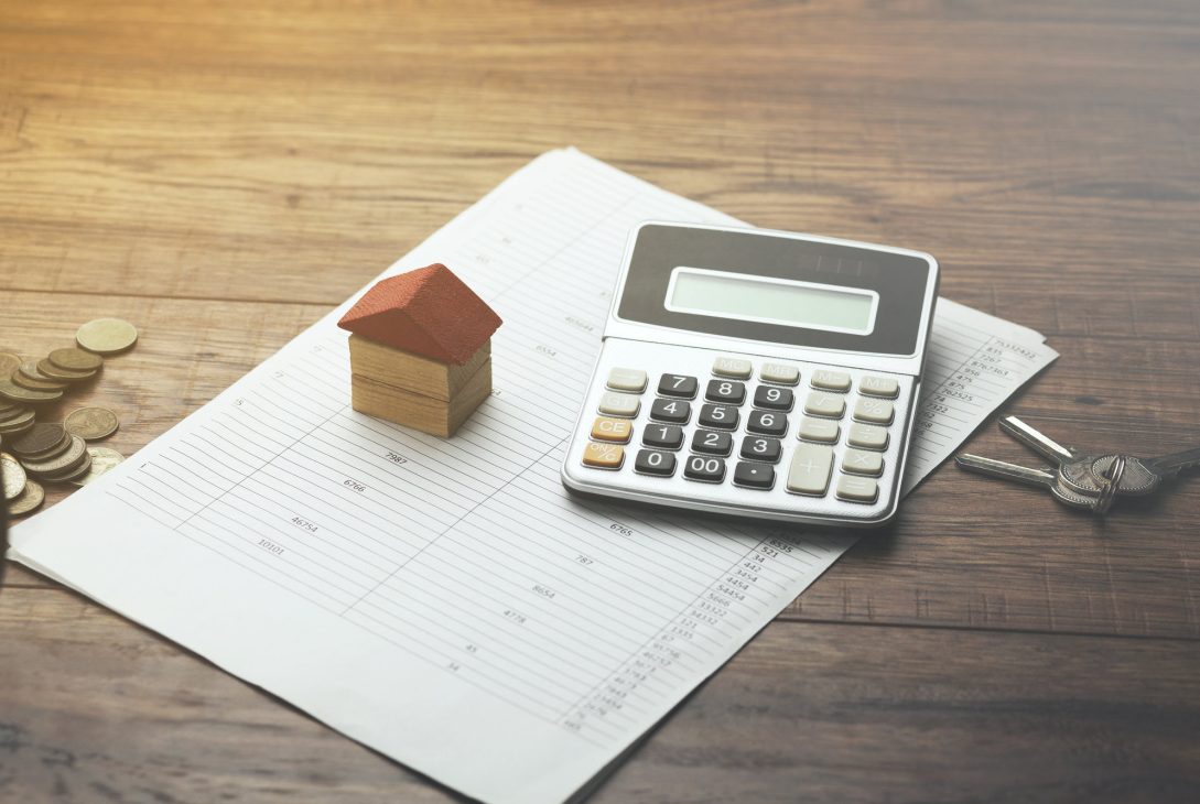 home sales, house,calculator and key on document