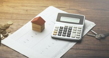 home sales, house,calculator and key on document