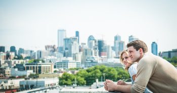 Young couple sitting on the sidelines to buy a home