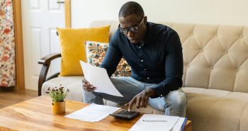 A man calculating his home affordability