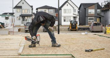 Canada Mortgage and Housing Corp. says the annual pace of housing starts in January fell 10 per cent compared with December. Framers work on a new house under construction in Airdrie, Alta., Friday, Jan. 28, 2022.THE CANADIAN PRESS/Jeff McIntosh Canada Mortgage and Housing Corp. says the annual pace of housing starts in January fell 10 per cent compared with December. Framers work on a new house under construction in Airdrie, Alta., Friday, Jan. 28, 2022.THE CANADIAN PRESS/Jeff McIntosh