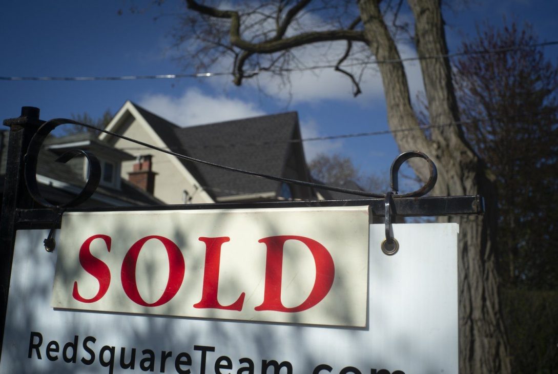 A real estate sold sign is shown in a Toronto west end neighbourhood May 16, 2020. THE CANADIAN PRESS/Graeme Roy