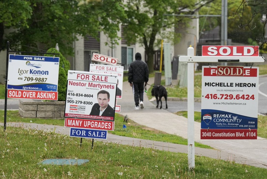 Experts say title and mortgage fraud are fast growing in Canada and homeowners should take steps to protect their properties — and their identities. A person walks past multiple for-sale and sold real estate signs in Mississauga, Ont., on Wednesday, May 24, 2023. THE CANADIAN PRESS/Nathan Denette Experts say title and mortgage fraud are fast growing in Canada and homeowners should take steps to protect their properties — and their identities. A person walks past multiple for-sale and sold real estate signs in Mississauga, Ont., on Wednesday, May 24, 2023. THE CANADIAN PRESS/Nathan Denette