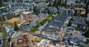 Cranes are seen above a condo development